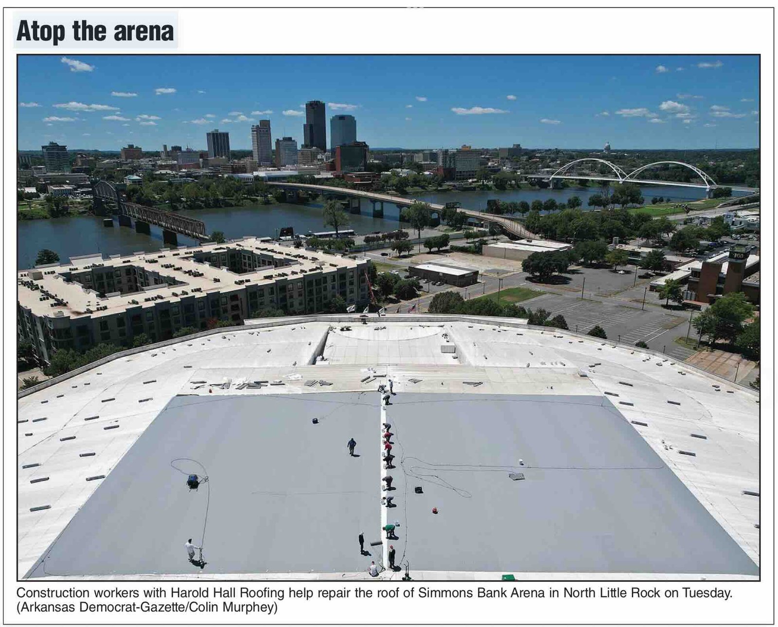 Commercial Roofers repair the Simmons Bank Arena roof in North Little Rock, AR